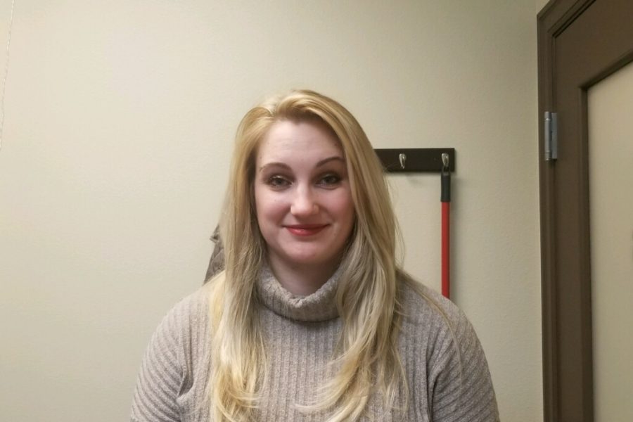 Long blond girl in beige turtleneck